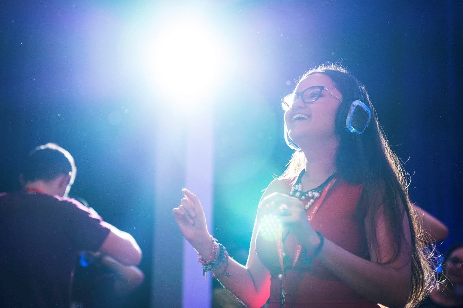 girl wearing headphones dancing at FEEcon 2019 silent disco